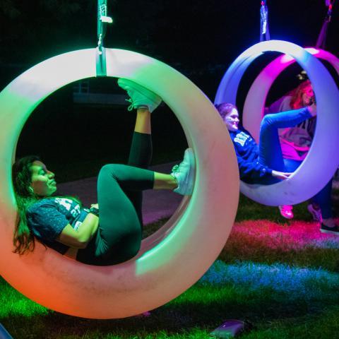 Students In colorful rings lawn on t